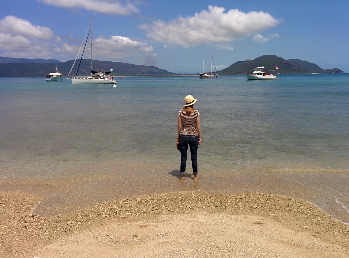 Standing on the beach looking at water