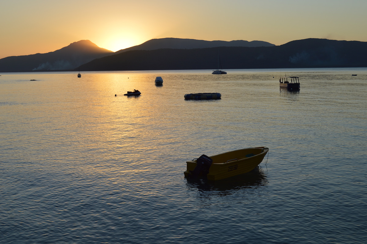 boats on the water at sunset