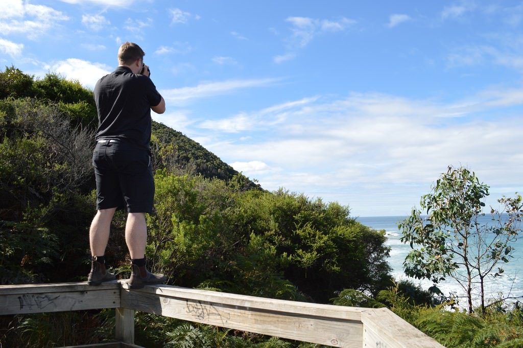 Nathan standing on a fence